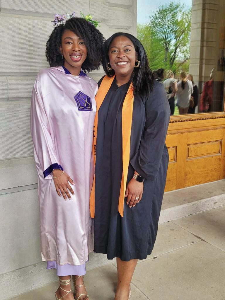 Lakenzie Bailey-House, left, and Christyl Barnes, right, smile together outside of Jesse Hall on the Mizzou campus.