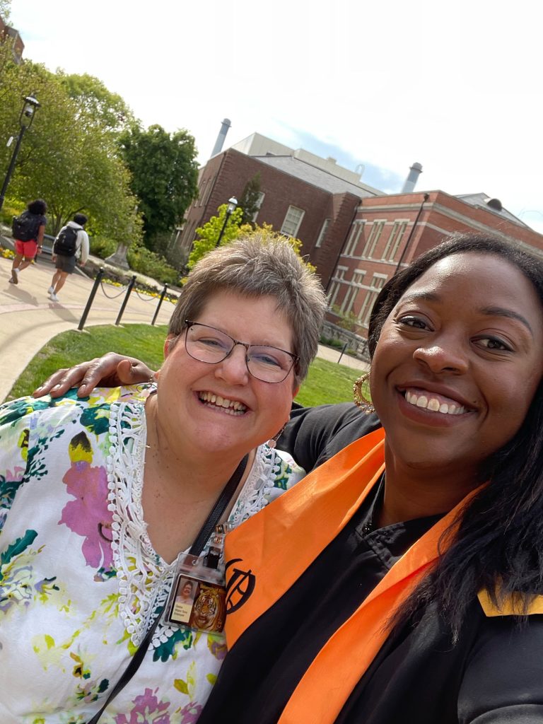 Faculty members Deidre Wipke-Tevis and Christyl Barnes smile together on Tap Day.