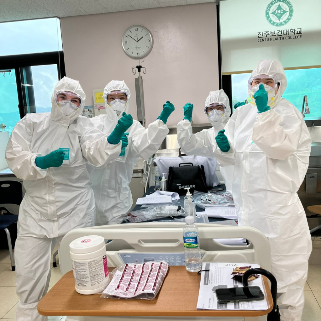Students do fun pose in PPE at Jinju Health College