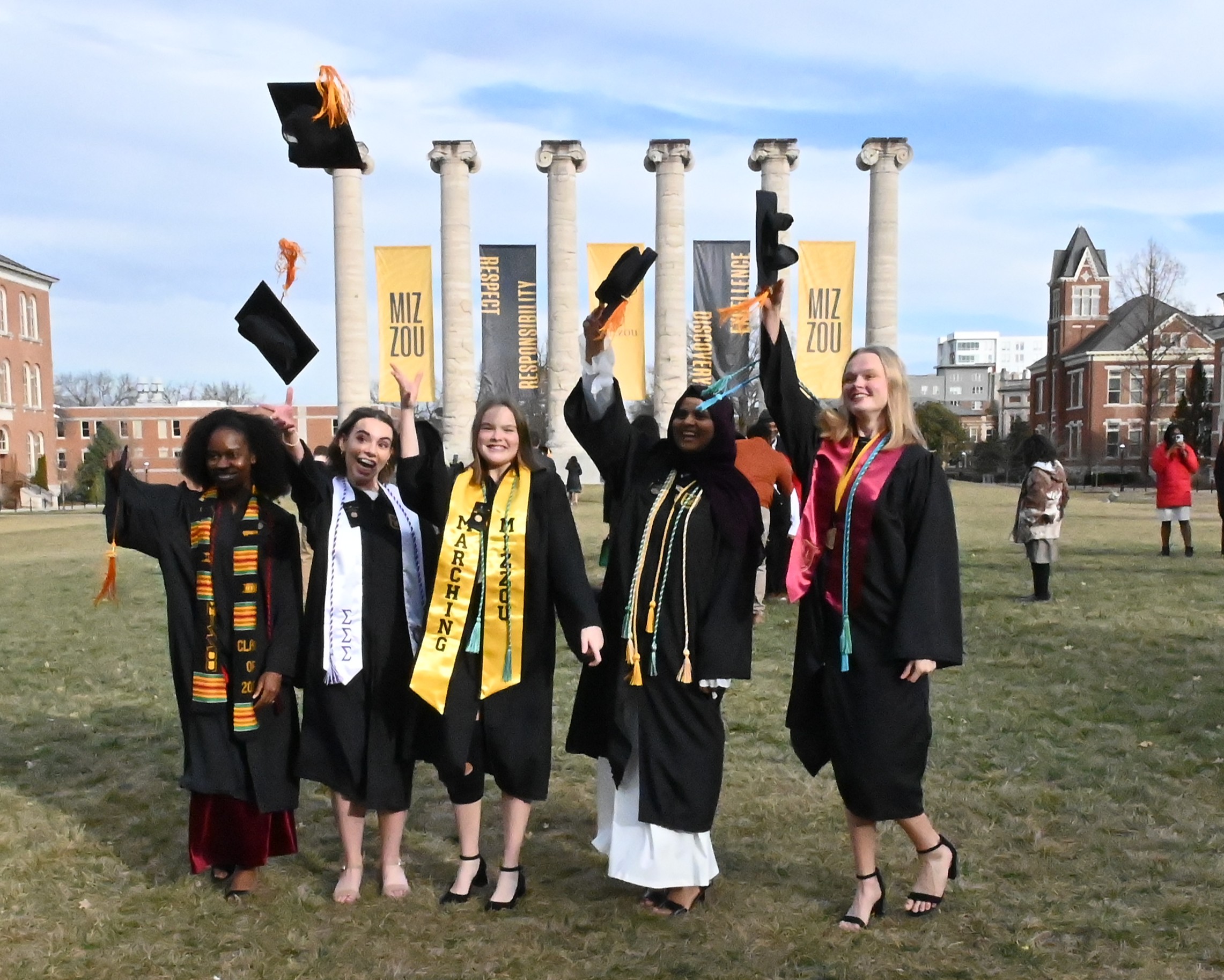 Nursing graduates in front of the Columns