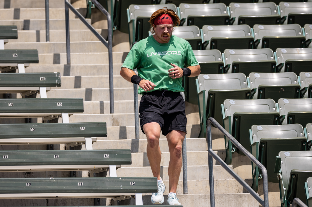 Jacob Schmidt running down stairs during marathon.