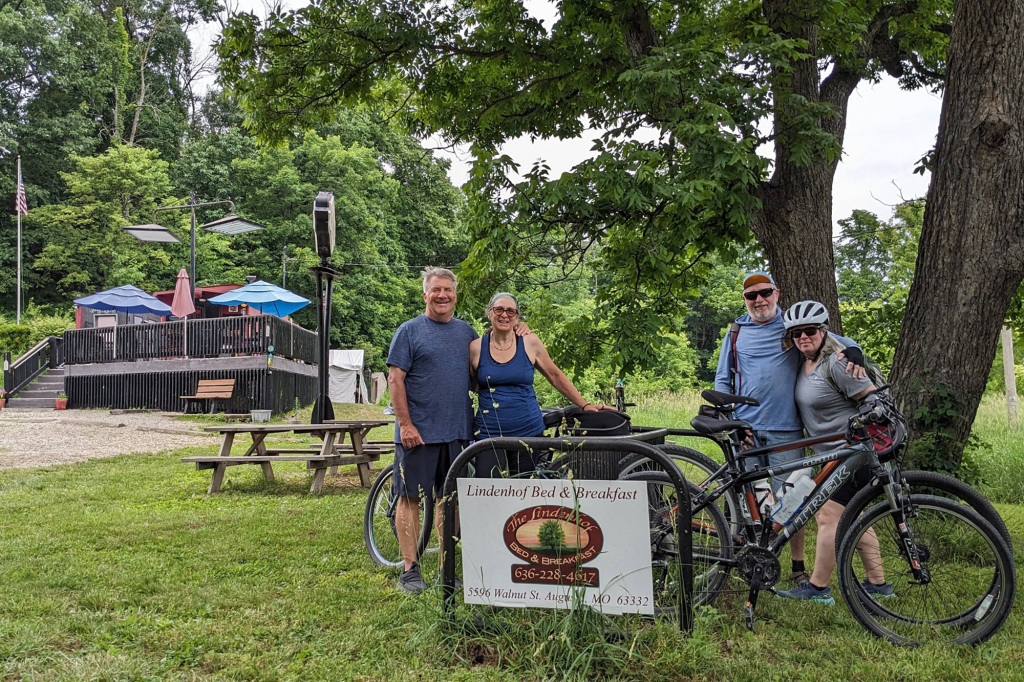 Miriam Butler (second from left) and Jennifer O'Connor (far right) preparing to bike with their husbands. Photo courtesy of Jennifer O’Connor