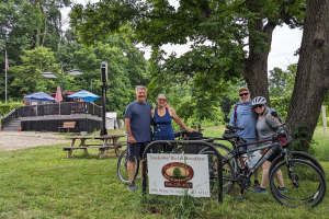 Miriam Butler (second from left) and Jennifer O'Connor (far right) preparing to bike with their husbands. Photo courtesy of Jennifer O’Connor